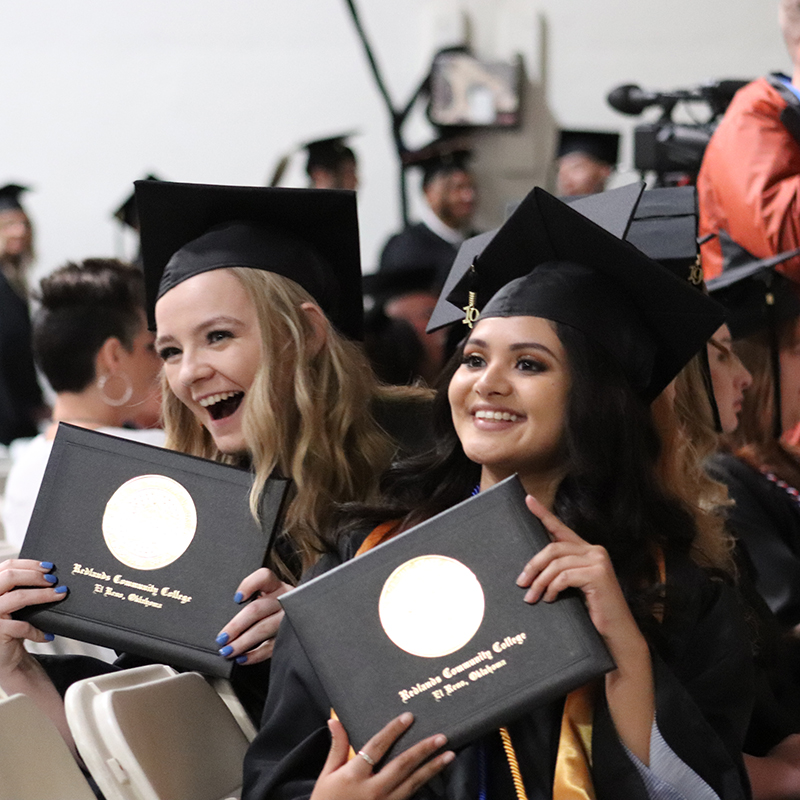 Redlands students smiling at graduation