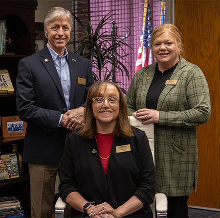 President Jena Marr, (seated) with Executive Vice President Jon Fields behind her to the left, and Vice President for Academic Affairs Annie Pearson to the right