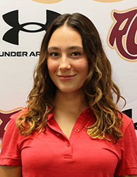 Smiling female student with wavy hair