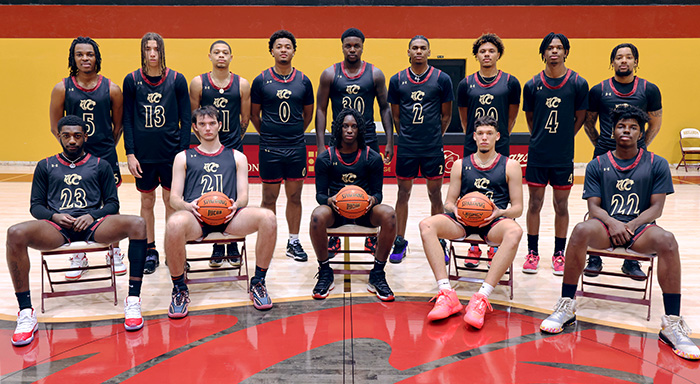 Men's basketball team at half court