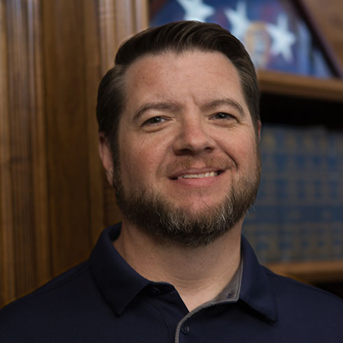 Man with brown hair and a beard