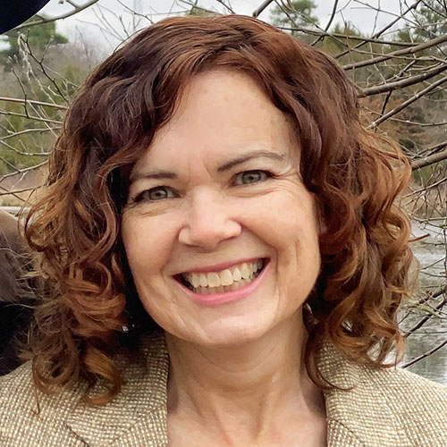 Woman with long red curly hair