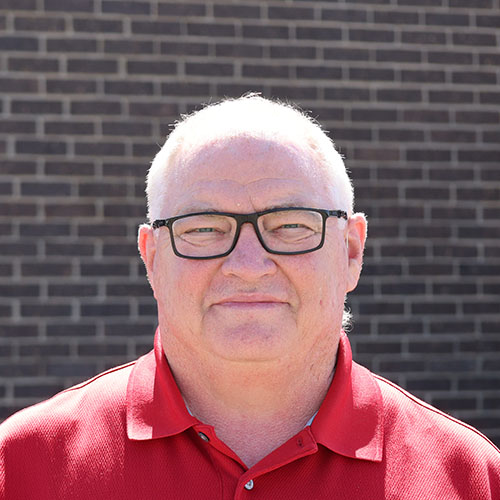 Man with short light hair and glasses