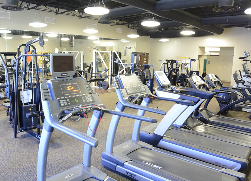 Fitness center with treadmills and weightlifting machines