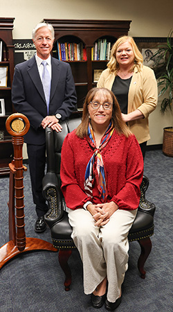 President Jena Marr, (seated) with Executive Vice President Jon Fields behind her to the left, and Vice President for Academic Affairs Annie Pearson to the right